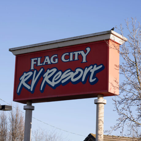 view of the sign at Flag City RV Resort in Lodi, CA.